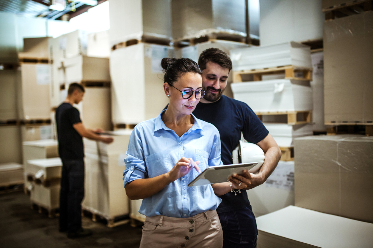 Amazon professionals using a tablet that is managed and secured by the SOTI ONE Platform