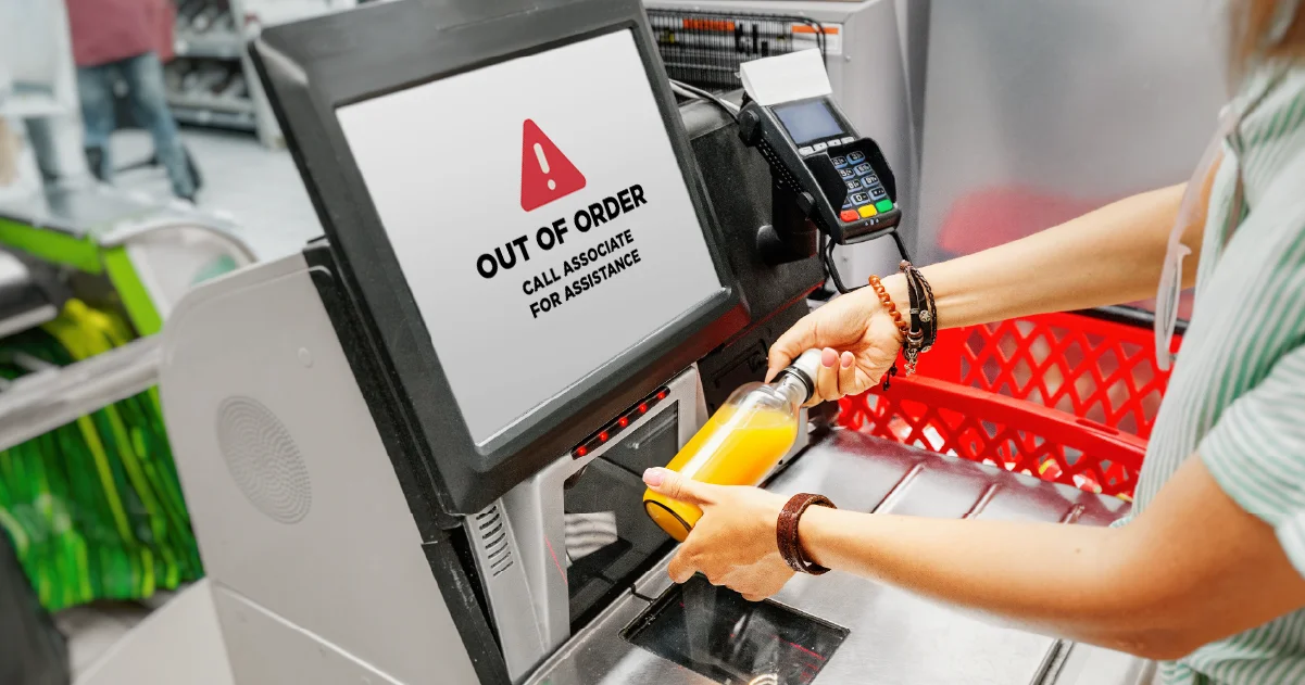 customer using self-checkout at grocery store