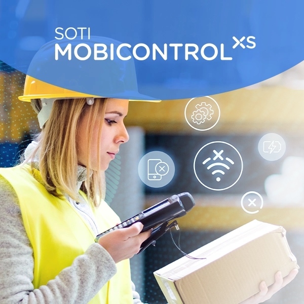 SOTI MobiControl | Lady in a vest and a hard hat scans a box in a warehouse