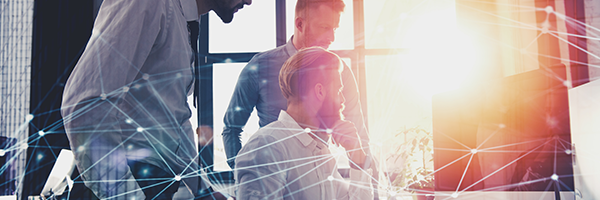 Group of three businessman looking at a large computer screen with a graphical image of a web portal superimposed on top.